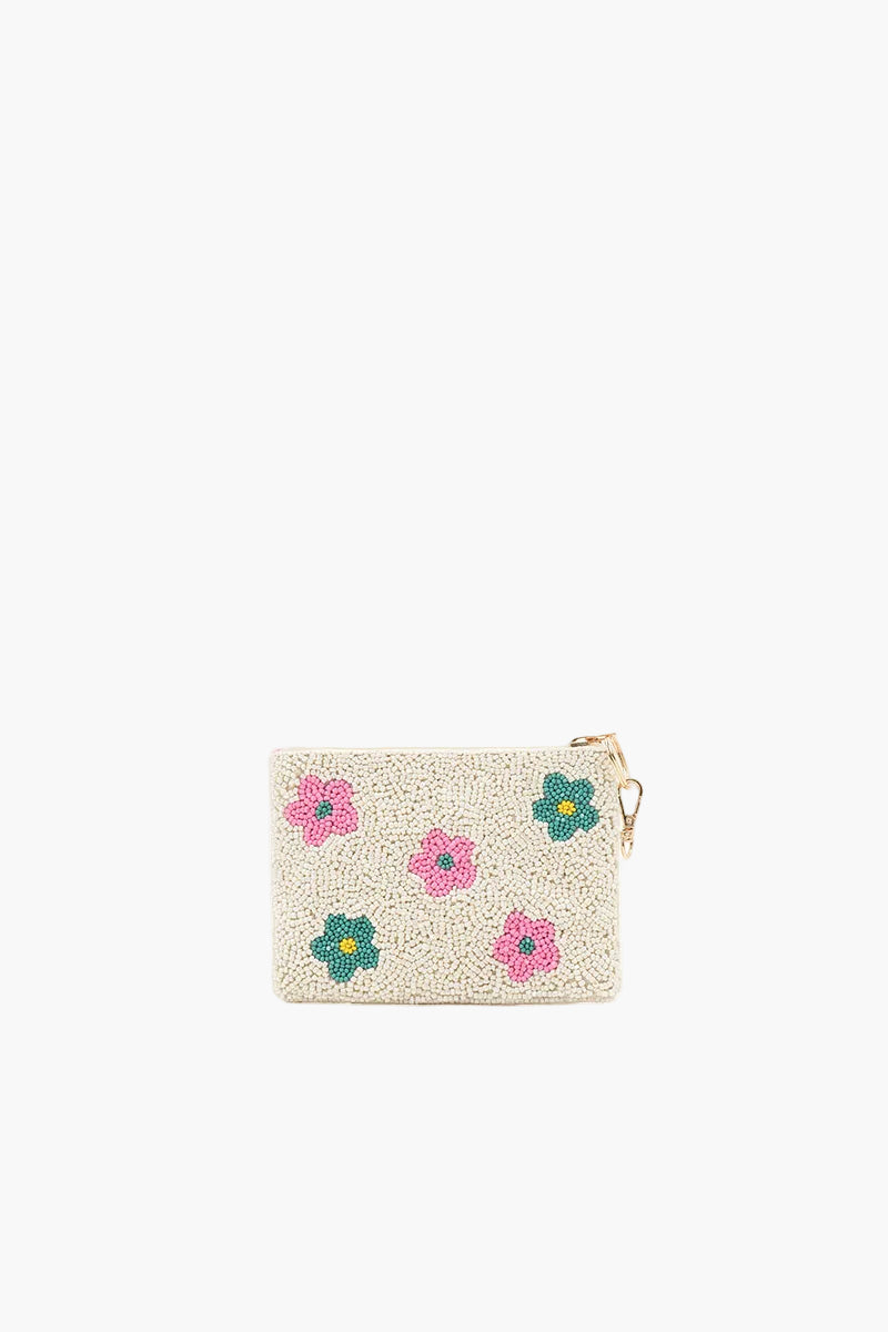 Beige pouch with floral designs on a white background