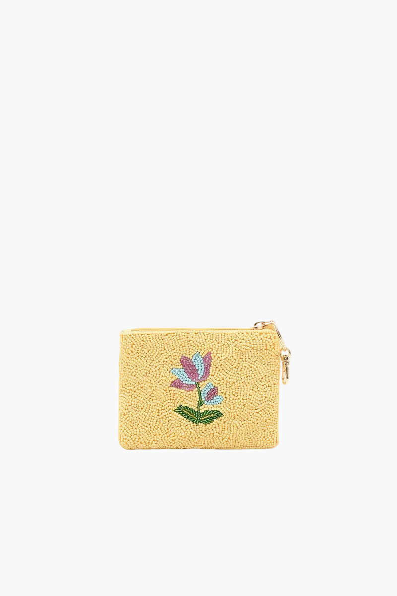 Yellow pouch with floral design on a white background