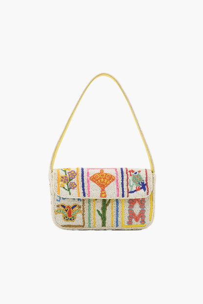 Colorful handbag with floral patterns on a white background