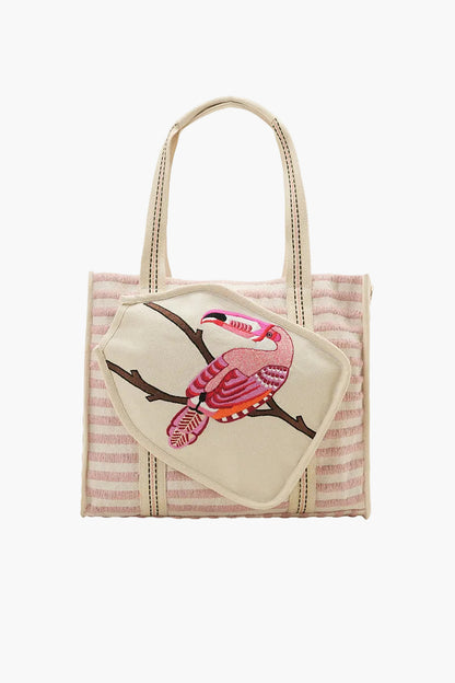 Striped tote bag with a bird design on a white background