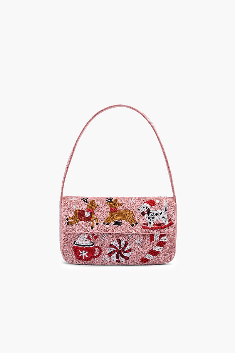 Christmas-themed handbag with reindeer, Santa, and candy cane design on a white background