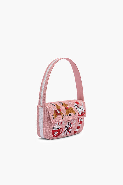 Pink handbag with festive design on a white background