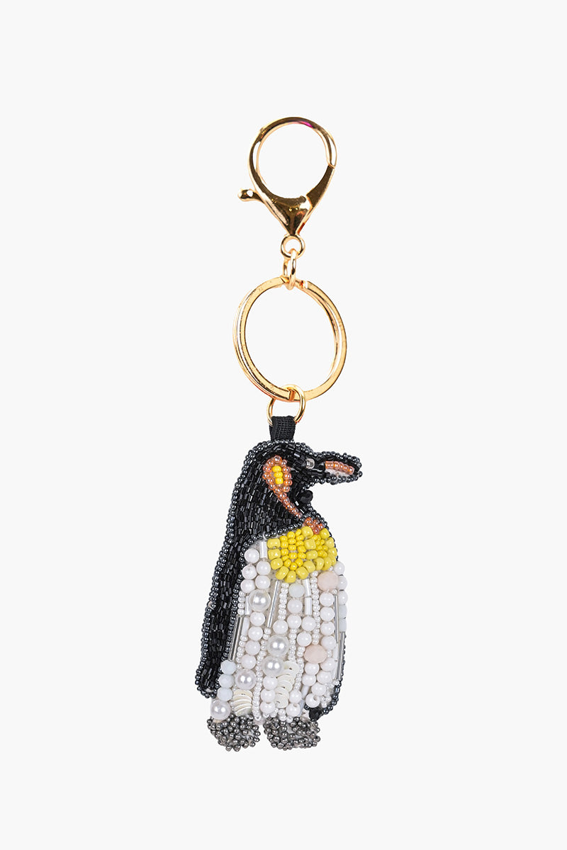 Penguin-shaped keychain with beads on a white background
