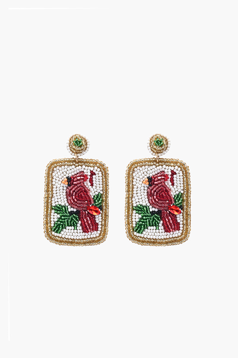 Pair of earrings with cardinal design on a white background