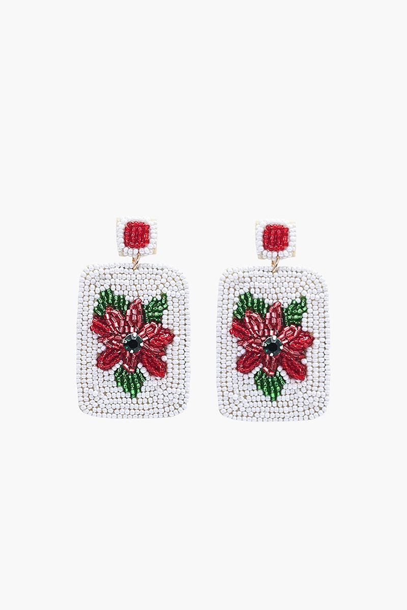 Square beaded earrings with red floral design on a white background
